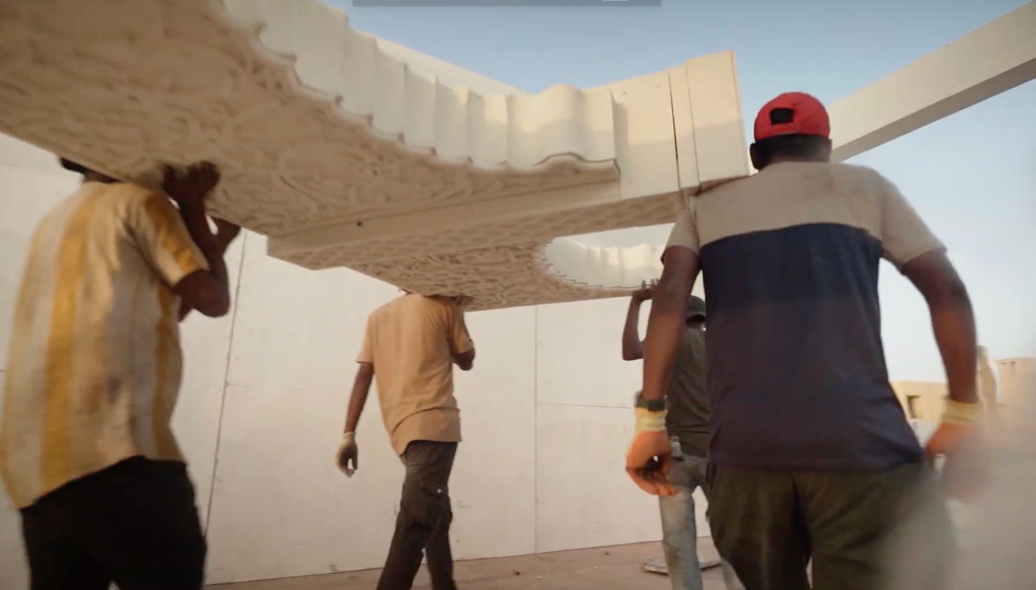 Crew carrying scenic fabrication